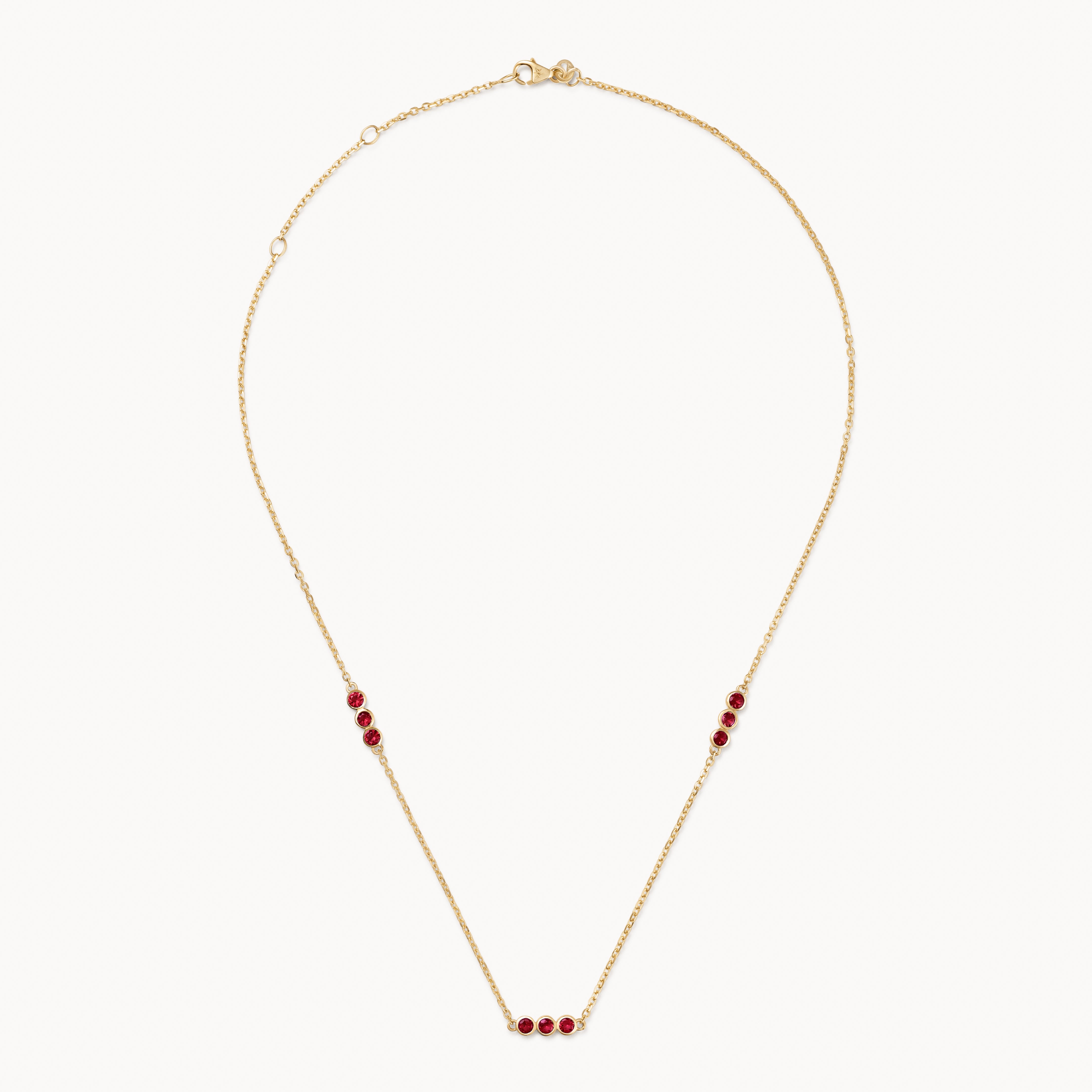 Ruby trio necklace in gold
