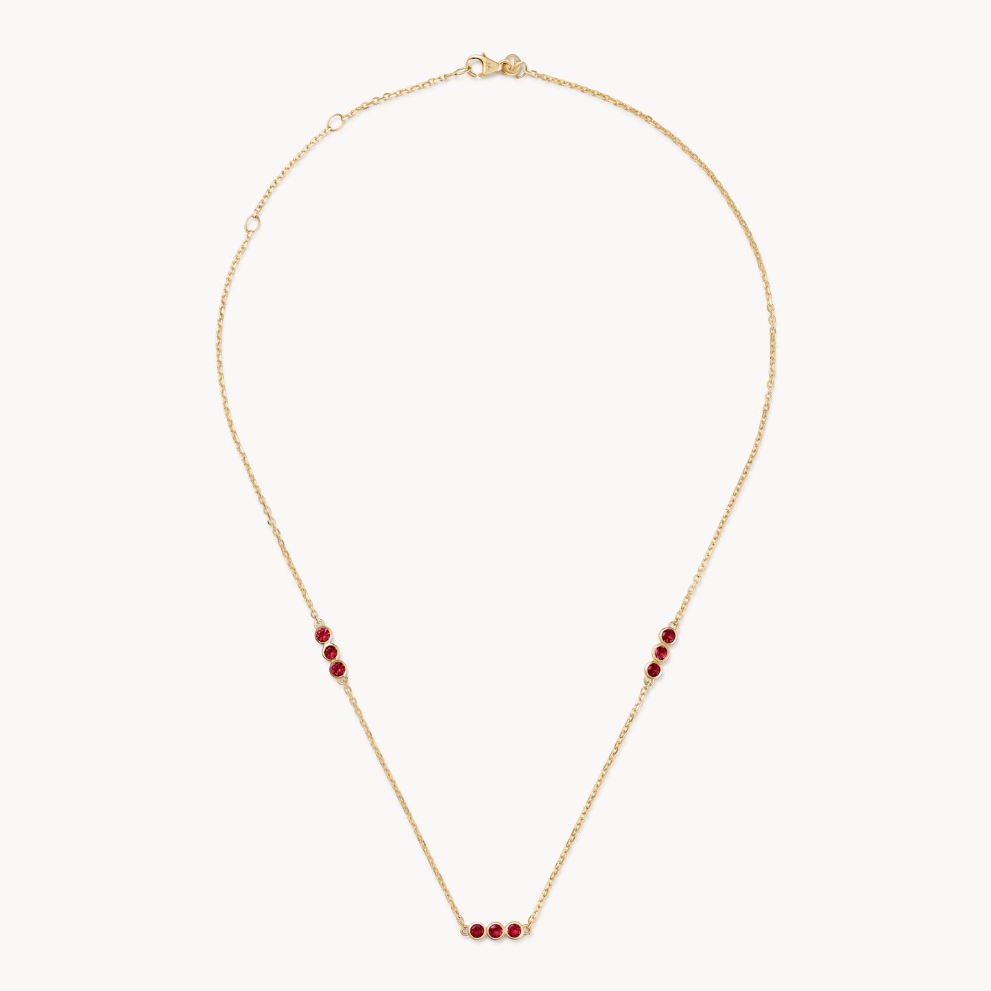 Ruby trio necklace in gold