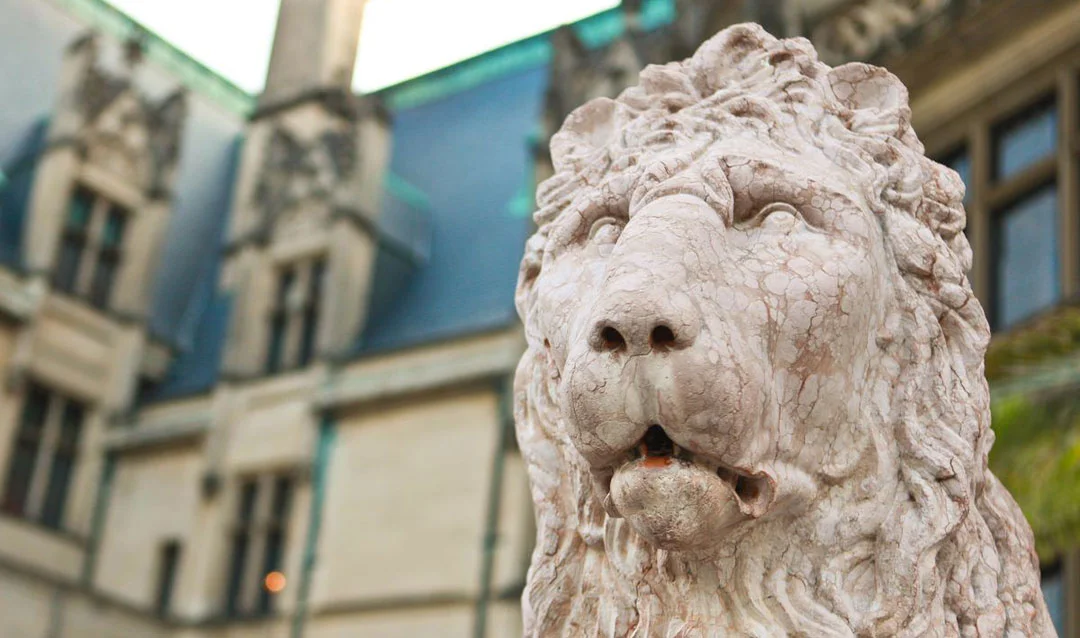 Lion statue in front of Biltmore mansion