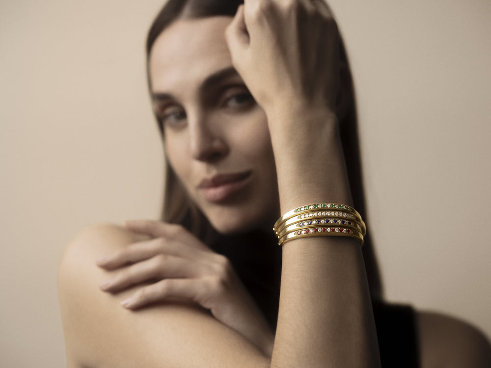 Portrait of a woman wearing four Stuyvesant bracelets