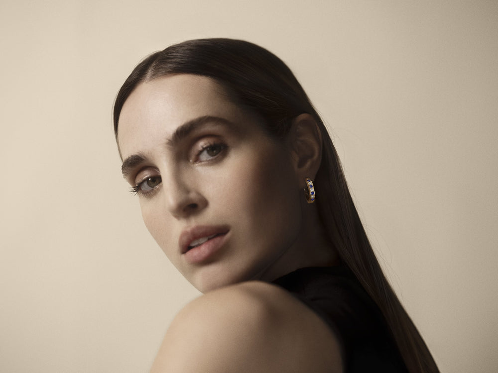 Portrait of a woman wearing sapphire Stuyvesant earrings